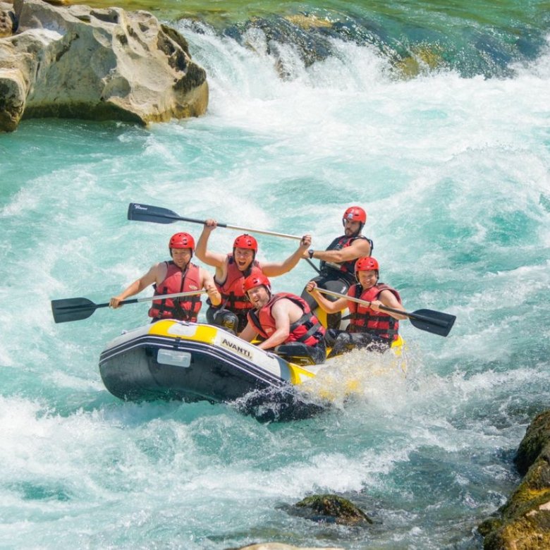 River rafting in Rishikesh on the Ganga with group navigating rapids