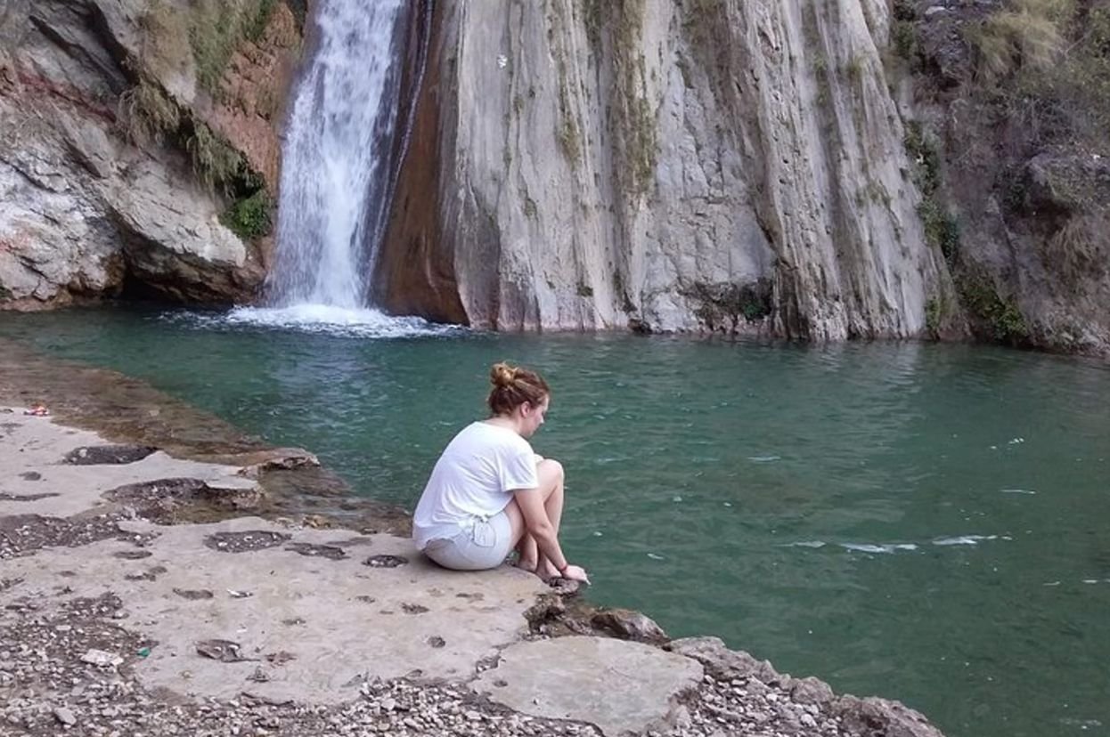 Neer Garh Waterfall in Rishikesh with natural pools, flowing water and lush green surroundings