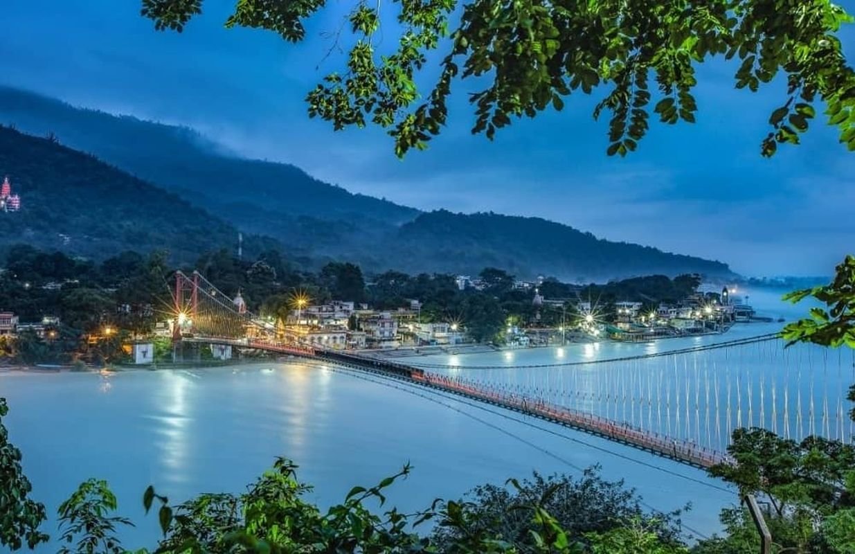 Ram Jhula suspension bridge in Rishikesh with scenic views of the Ganga and surrounding temples