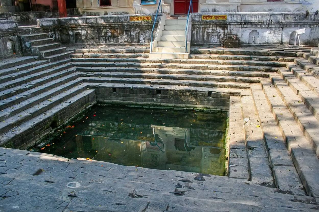 Rishikund hot water spring in Rishikesh surrounded by ancient stone steps and a peaceful spiritual atmosphere