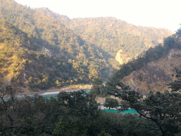 Quiet riverside view at Phool Chatti near Rishikesh with calm Ganga flow and minimal surroundings