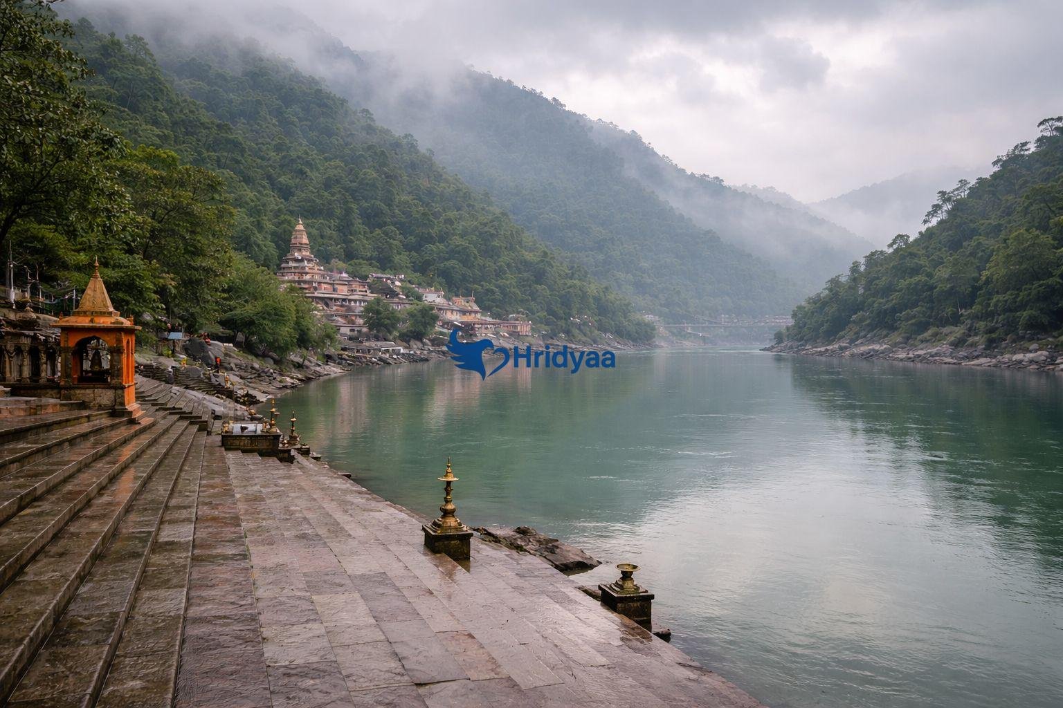 Monsoon season in Rishikesh with misty hills and calm Ganga river