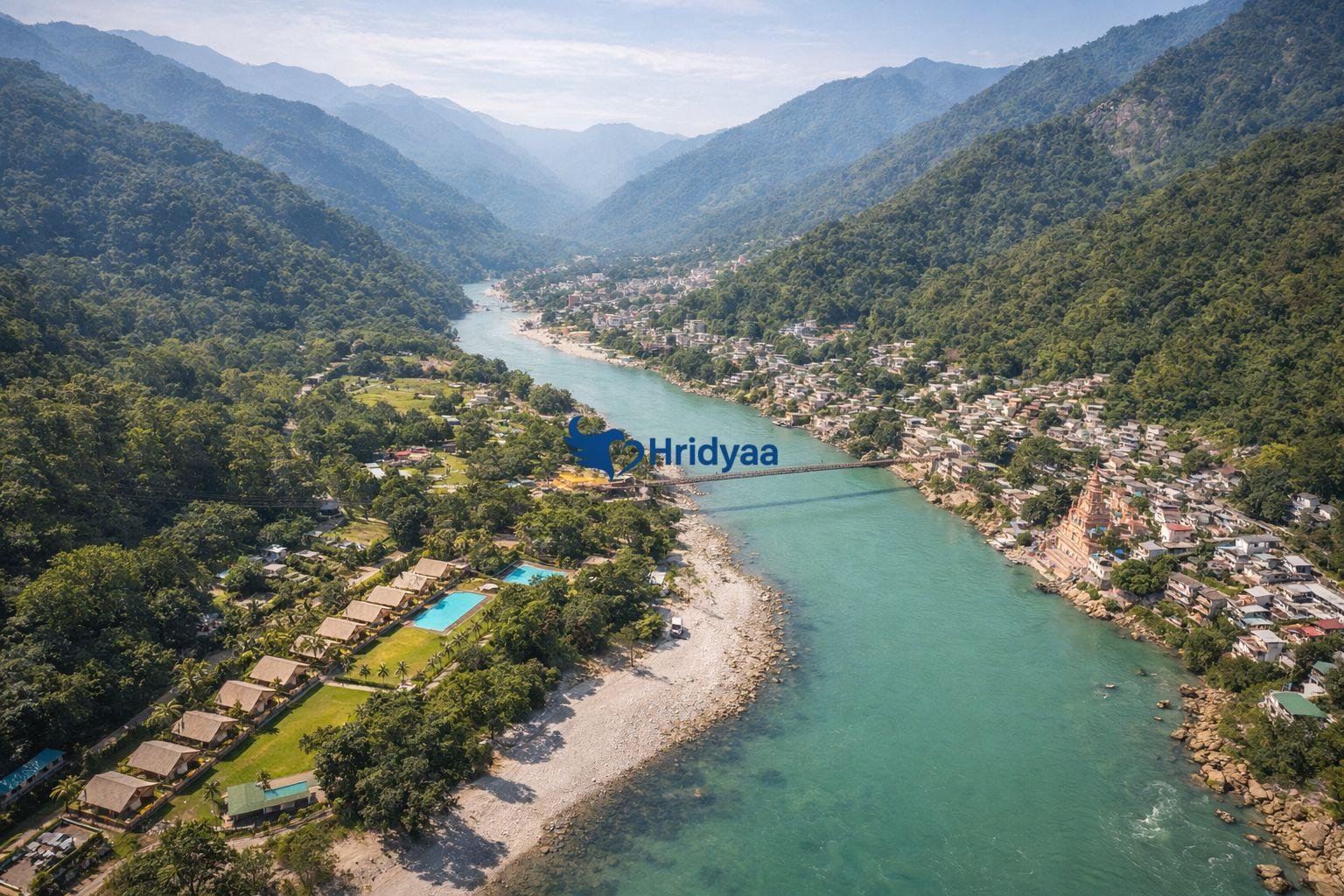 Aerial view of Rishikesh resort areas near river and hills