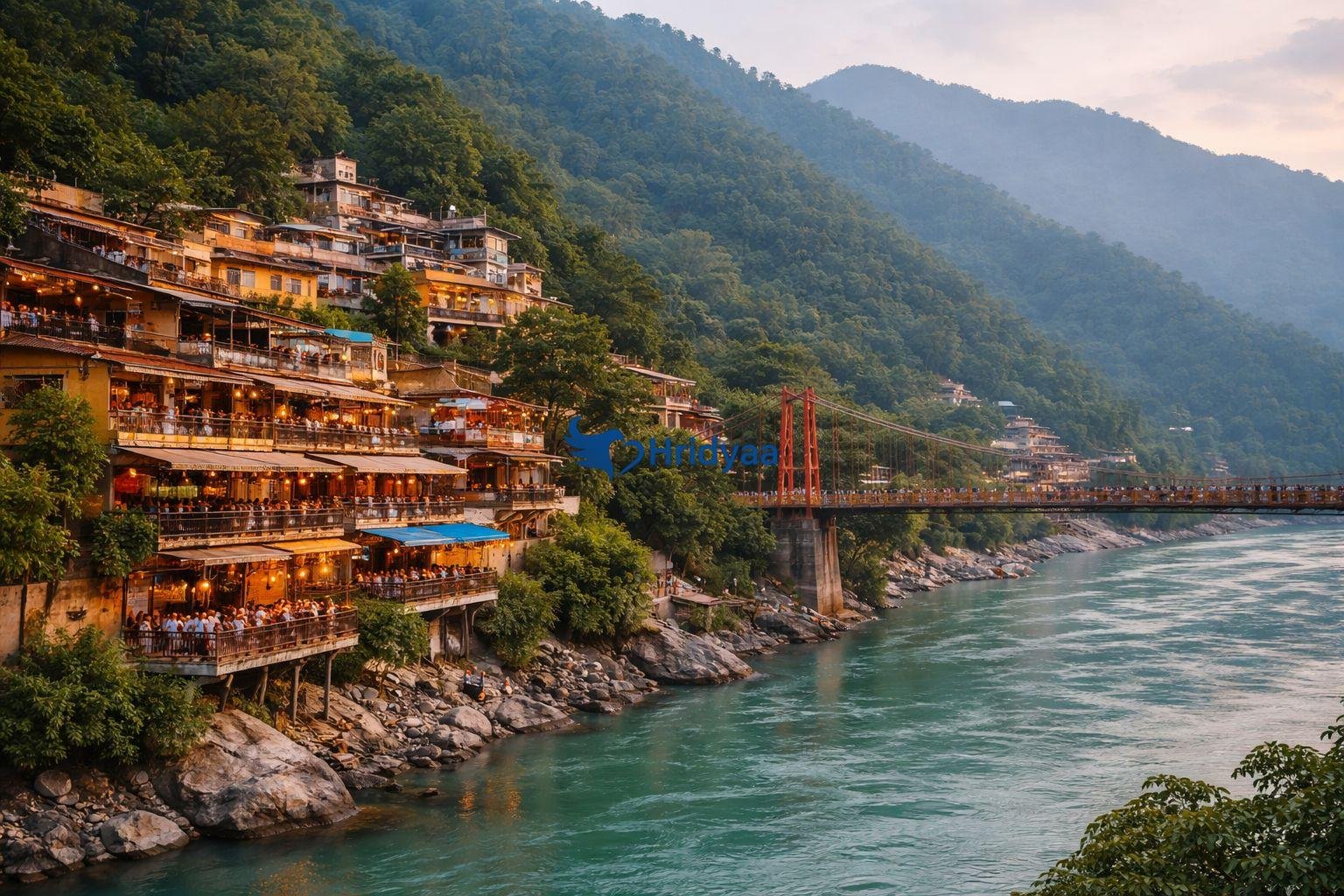 laxman jhula bridge with nearby cafes overlooking ganga river